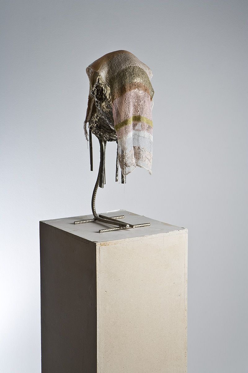 Martin Erik Andersen, <i>Head with Cloth</i>, 2002<br>Nickeled bronze, and acrylic knitwear on paper covered plinth. 59 cm (height)<br>Purchased 2002 with support from Ny Carlsbergfondet. Inv.nr. 2002-017. ©The artist. Photo: Ole Bjørn Petersen